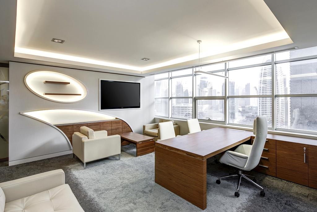 Professional cleaner organizing a living room
